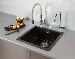 Two faucets in the kitchen photo