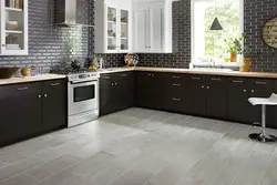 Black tiles on the kitchen floor photo