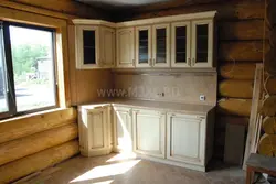 Corner kitchens in a wooden house with a window photo