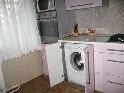 Photo of a kitchen in Khrushchev with a refrigerator and a washing machine photo