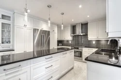 Gray kitchen with black handles in the interior