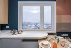 Photo of a plastic window for the kitchen with installation