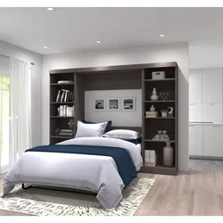 Bedroom interiors with bed and wardrobe photo