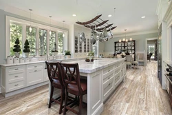 Photo of a kitchen with marbled porcelain stoneware floors