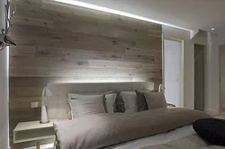 Gray laminate on the wall in the bedroom interior