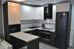 Kitchen design with built-in appliances and refrigerator photo