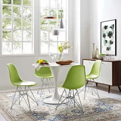 Photo of a kitchen with green chairs