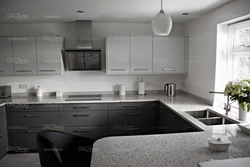 Kitchen with dark gray countertop photo