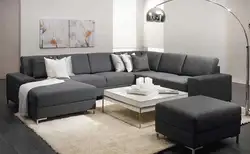 Графитовый диван в интерьере гостиной