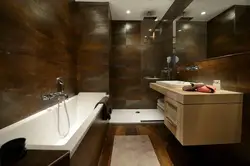 Bathroom design with dark tiles and wood