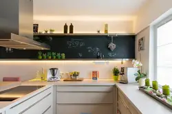 Photo of a kitchen without wall cabinets