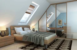 Bedroom interior in a house with a sloping ceiling