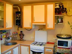 Kitchen design 5 sq.m. with refrigerator and geyser