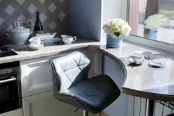 Countertop together with a window sill in the kitchen photo