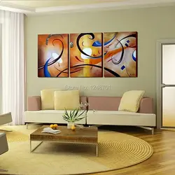 Картины на стене в интерьере гостиной в современном стиле