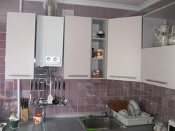 Photo of a kitchen in a house with a boiler on the wall