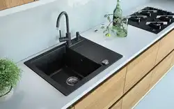 Black sink in the kitchen interior