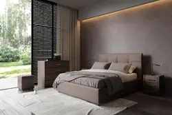 Photo of a bedroom with a soft headboard