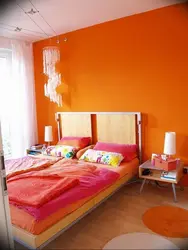 Оранжевый цвет в спальне фото