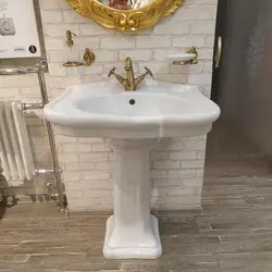 Sink with pedestal in the bathroom interior