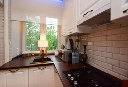 Photo of a small kitchen by the window