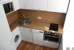 Kitchen 8 sq m design with refrigerator and washing machine