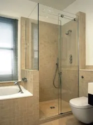 Дизайн ванной комнаты с душевой кабиной и инсталляцией