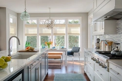 Photo of a kitchen with a window in light colors