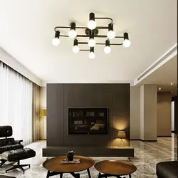 Черные светильники в интерьере гостиной