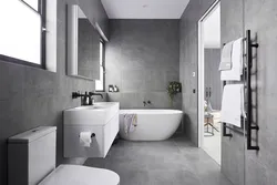 Bathroom design with gray tiles on the floor