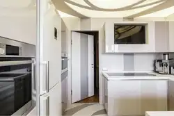 Телевизор над холодильником в кухне фото