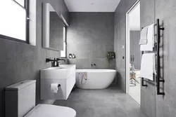 Интерьер ванной комнаты с серым полом