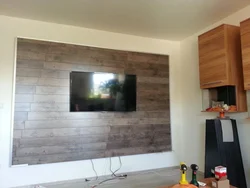 Ламинат на стену в гостиной фото под телевизор