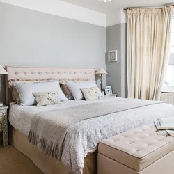 Color combination of gray and beige in the bedroom interior