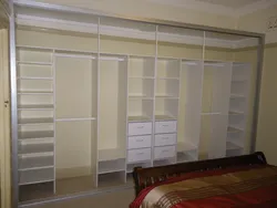 Wall-to-wall wardrobe in the bedroom photo with a view