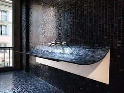 Black mosaic tiles in the bathroom photo