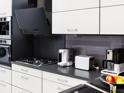 White kitchen black appliances in the interior