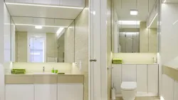 Photo of a bathroom cabinet up to the ceiling