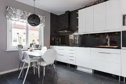 Kitchen interior with black and white apron photo