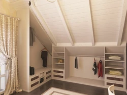 Гардеробная комната в мансарде со скошенным потолком фото
