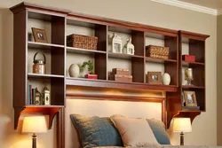 Shelves above the bed in the bedroom interior
