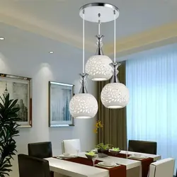 Chandelier for the kitchen on a suspended ceiling in a modern style photo