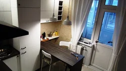 Small kitchen design with access to the balcony