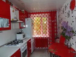 Red interior of a small kitchen