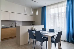 Blue curtains in the kitchen interior photo