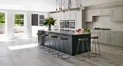 Gray porcelain tiles on the floor in the kitchen interior