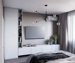 Шкаф с телевизором в интерьере спальни