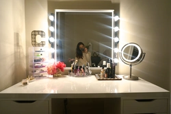 Illuminated mirror in the bedroom interior