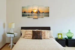 Paintings above the headboard in the bedroom photo