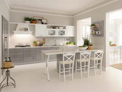 Серая кухня с белым столом фото